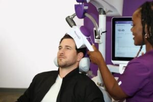 Patient receiving brain stimulation therapy, illustrating the experience of Standard vs. Accelerated TMS treatment.