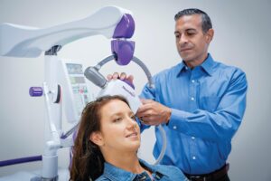 Patient receiving transcranial magnetic stimulation treatment for depression in an outpatient clinic.